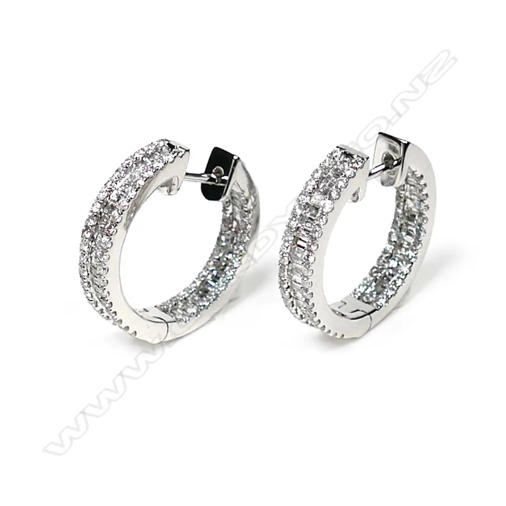 A pair of 18ct white gold and diamond hoop earrings Image 1++