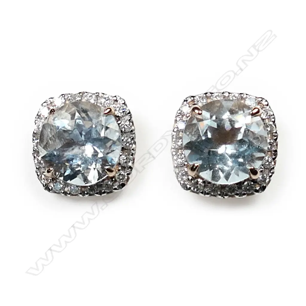 A pair of 14ct rose gold aquamarine and diamond halo stud earrings, each earring set with a 1.65ct round cut, greyish-blue aquamarine (eye clean clarity), and surrounded by a halo of eighteen round brilliant cut diamonds (H-J colour, SI2-I2 clarity), posts for pierced ears, TDW 0.28ct, TAW 3.31ct. Image 1++