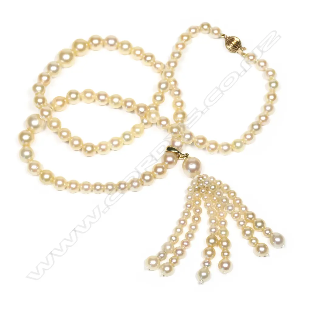 An Akoya type pearl lariat style necklace, a single strand of eighty graduated Akoya type cultured pearls (4.66mm - 6.67mm), deep cream lustre, with detachable 9ct gold and pearl tassel, 9ct gold ball clasp. Image 1++