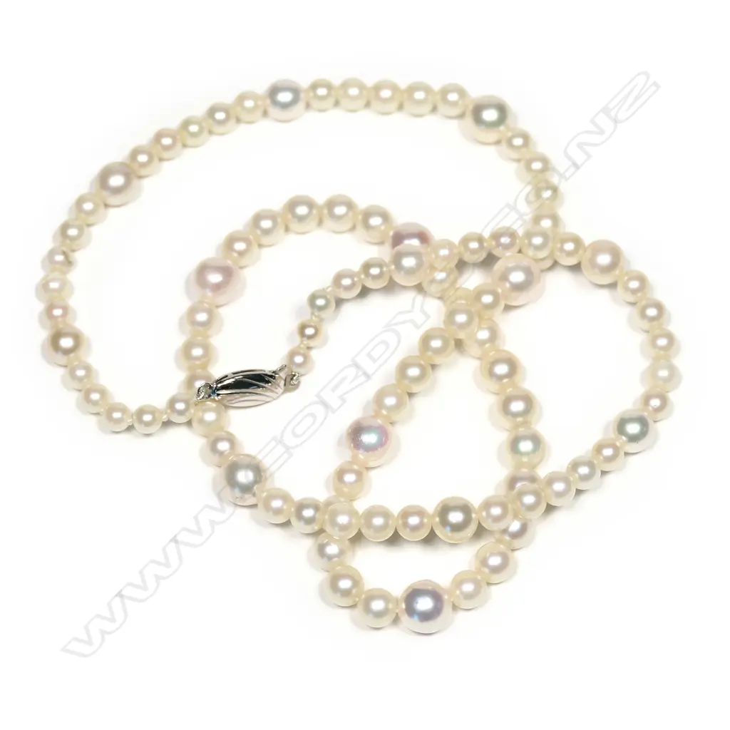 An Akoya pearl necklace, a single strand of ninety-four Akoya cultured pearls, (4.6mm - 8.1mm), white with pinkish overtones, with silver clasp.  Valuation available. Image 1++