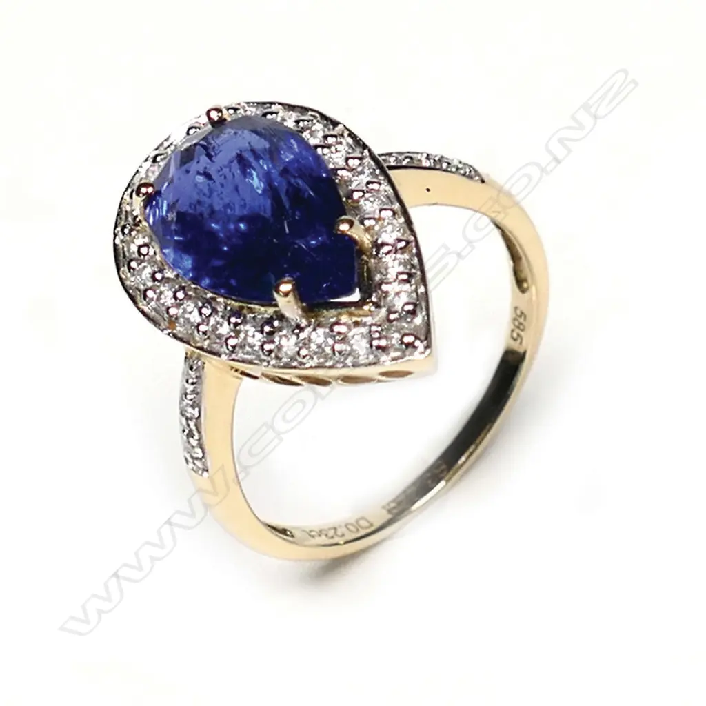 A 14ct gold tanzanite and diamond antique style halo ring, a 3.22ct pear faceted cut vivid violet blue tanzanite (moderate-heavy inclusions), claw set and surrounded by round brilliant cut diamonds with further diamonds to the band, (G-I colour, SI-I2 clarity) TDW 0.23ct, ring size N. Image 1++