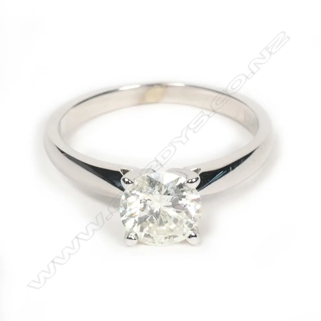 An 18ct white gold and diamond solitaire ring, the 1.02ct round brilliant cut diamond claw set, (Colour J-K, Clarity I2). Valuation available. Image 1++