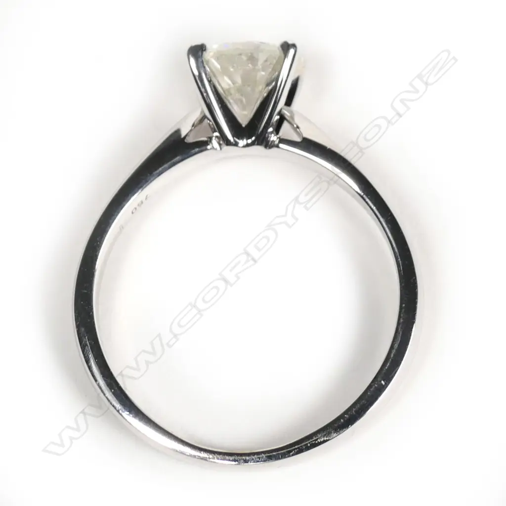An 18ct white gold and diamond solitaire ring, the 1.02ct round brilliant cut diamond claw set, (Colour J-K, Clarity I2). Valuation available. Image 1++