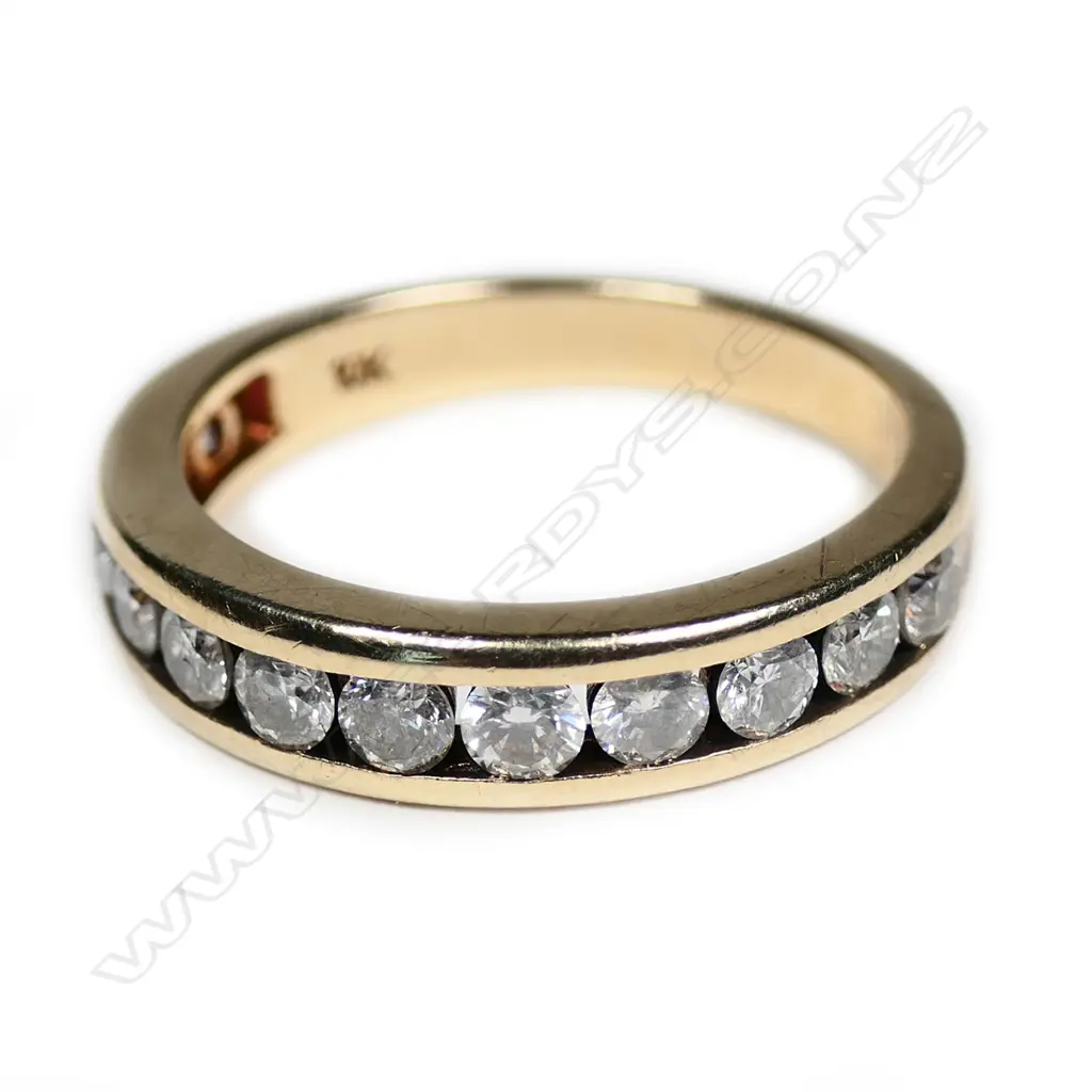 A 18ct gold 12 stone diamond ring, channel set, TDW. 1.95cts. Valuation available. Image 1++