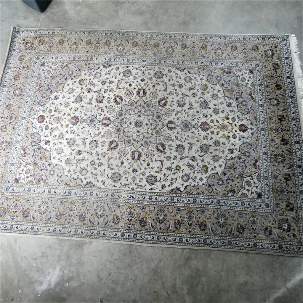 A Persian hand knotted carpet, curvilinear flowering tendril design in pale tones. One lighter area and minor signs of wear. 3500 x 2550mm. Image 1++