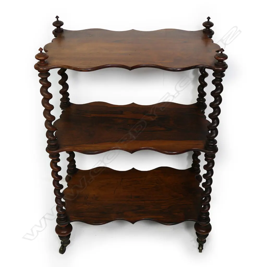 A Victorian rosewood three tier whatnot, barley twist supports, brass casters.  610 x 350 x 880mm. Image 1++