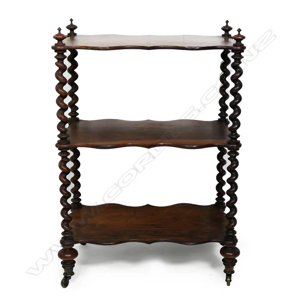 A Victorian rosewood three tier whatnot, barley twist supports, brass casters.  610 x 350 x 880mm. Image 1++