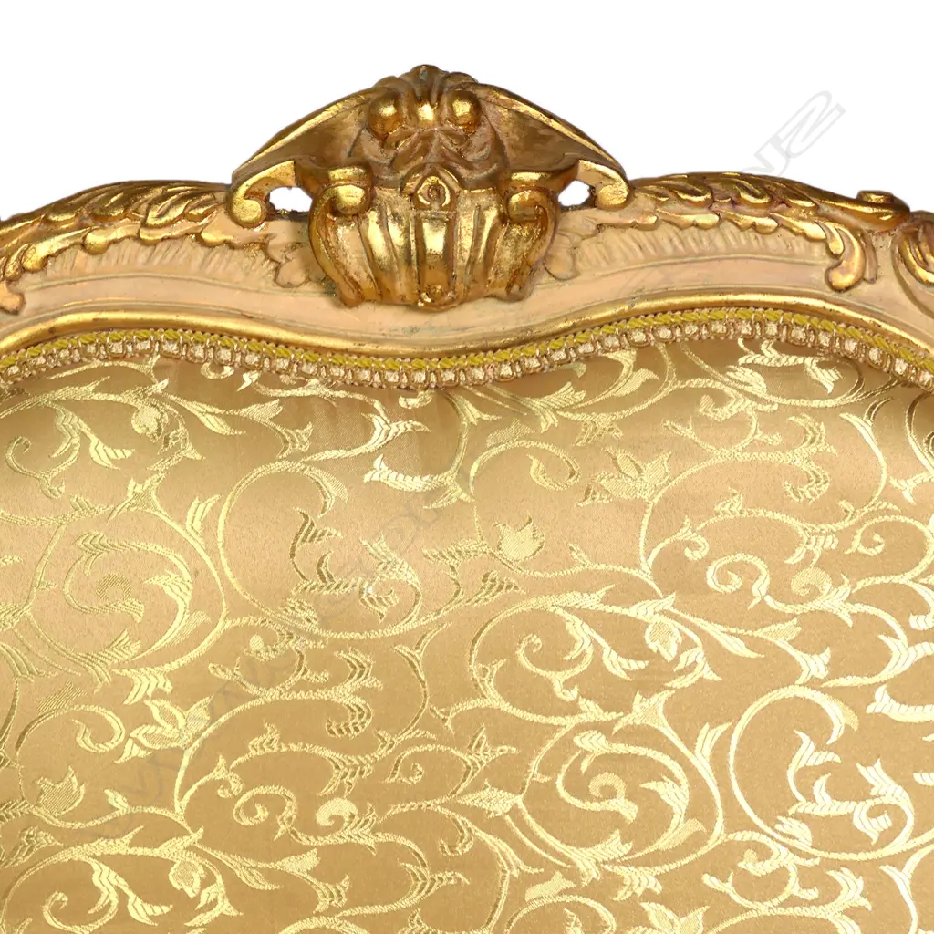 A pair of antique 20thC French style bergère armchairs, carved and painted frames with silken pale gold upholstery patterned with scrolling tendrils. 760 x 620 x 1300mm. Image 1++