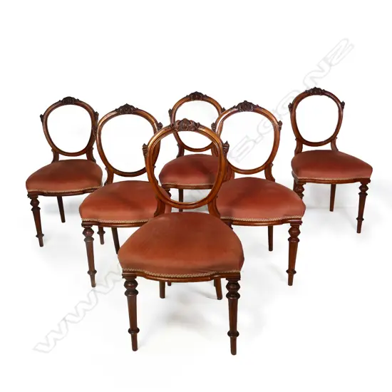 A set of six Victorian carved walnut balloon back chairs, traditional open oval backs finely detailed, turned front legs.