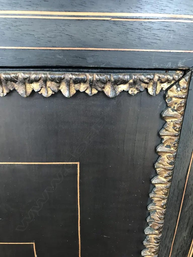 A Victorian ebonised credenza, decorative stringing with ormolu embellishments, shaped doors to the sides, the front with a Sevres style plaque to the centre, raised on plinth base and squat bun feet. 1680 x 420 x 1080mm. Image 1++