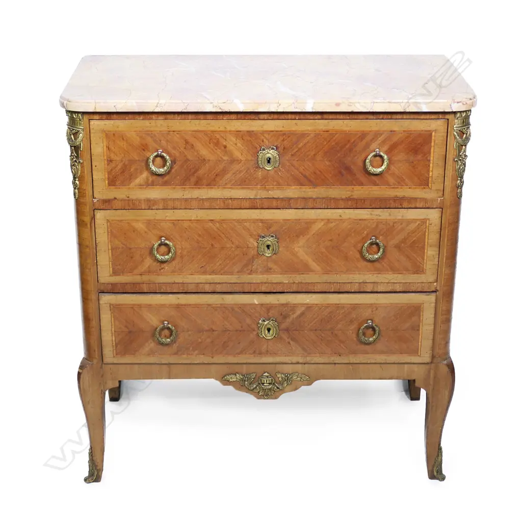 A French marble top three drawer commode, variegated marble top with ormolu embellishments, raised on chamfered tapering legs.  800 x 410 x 860mm. Image 1++