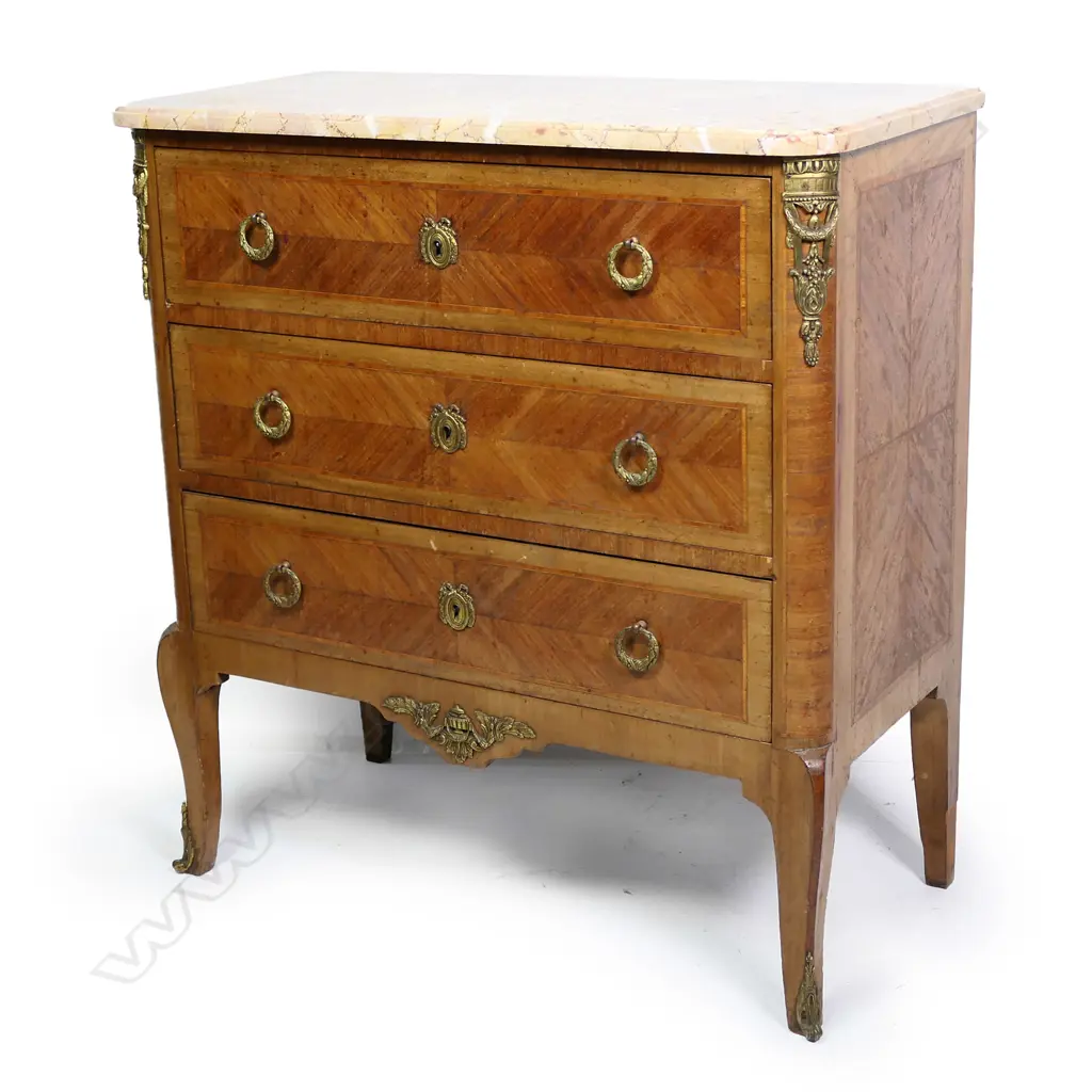 A French marble top three drawer commode, variegated marble top with ormolu embellishments, raised on chamfered tapering legs.  800 x 410 x 860mm. Image 1++