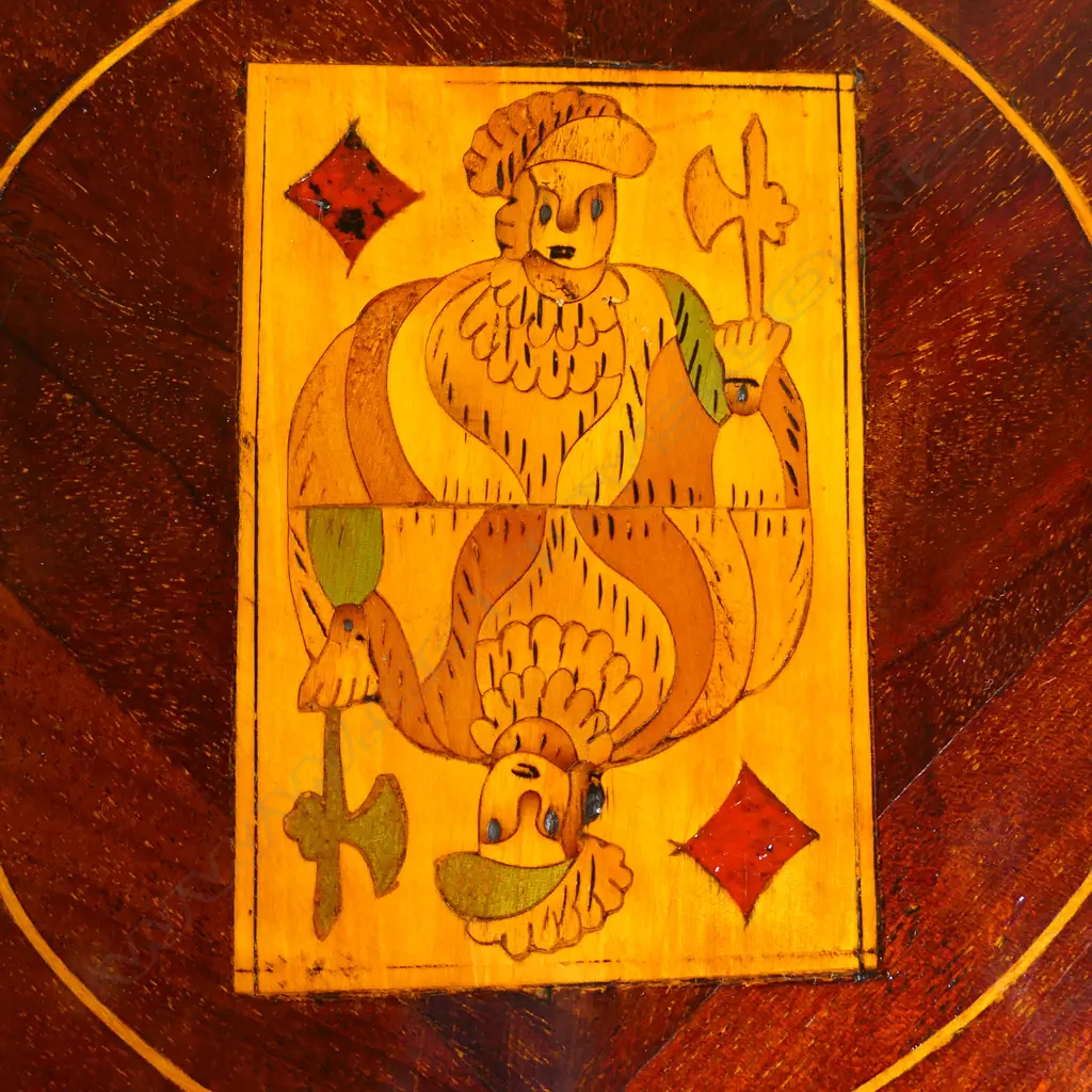A 19thC Dutch marquetry card table, the top inlaid with flowers and a bow, the interior lined with black baize and inlaid with a suite of cards and more flowers, conforming inlaid decoration to the aprons and legs.  830 x 420 x 730mm. Image 1++