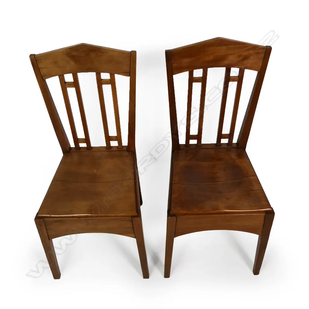A pair of rimu Roy Lippincott lecture chairs, designed for the Old Arts/Clock Tower Building (1926) at 22 Princes St, Auckland which Lippincott also designed. Professional restoration to the seat of one chair. Image 1++
