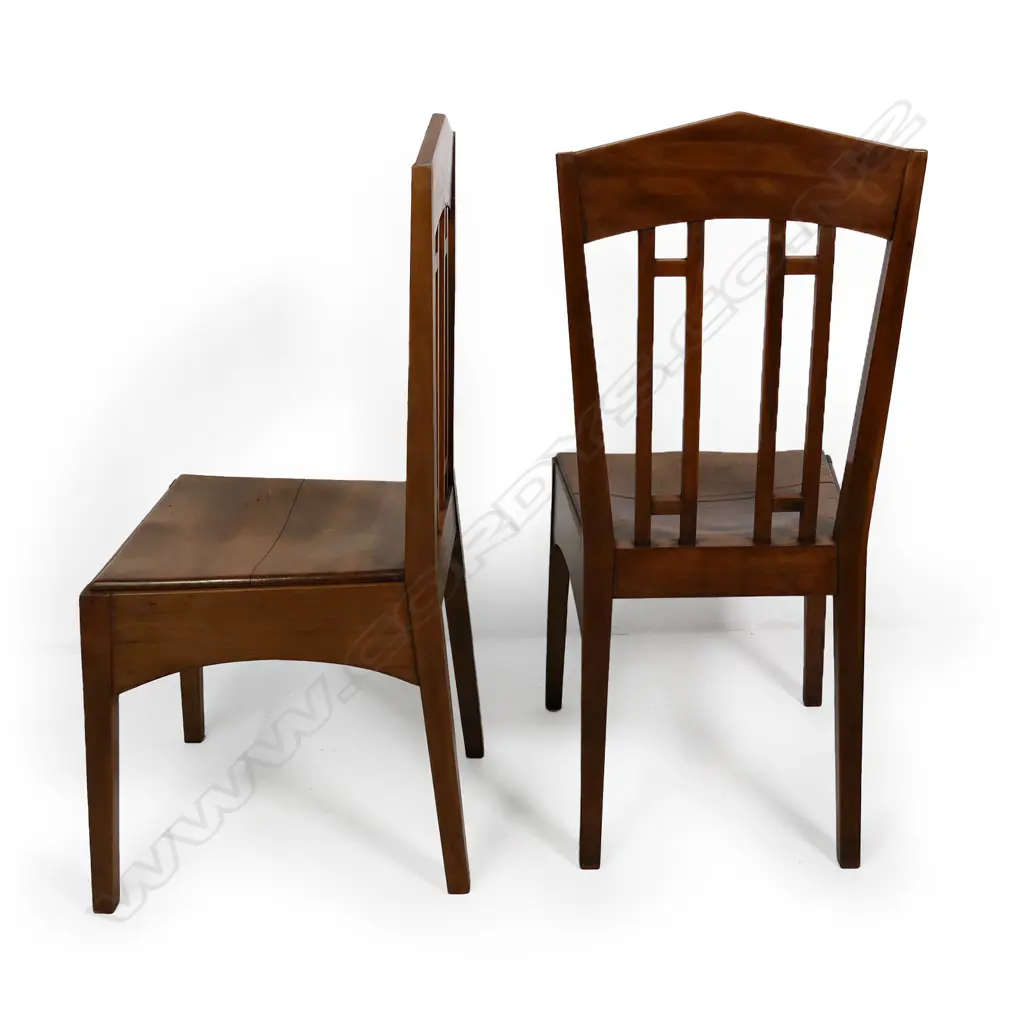 A pair of rimu Roy Lippincott lecture chairs, designed for the Old Arts/Clock Tower Building (1926) at 22 Princes St, Auckland which Lippincott also designed. Professional restoration to the seat of one chair. Image 1++