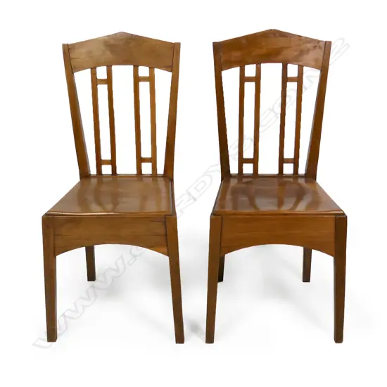 A pair of rimu Roy Lippincott lecture chairs, designed for the Old Arts/Clock Tower Building (1926) at 22 Princes St, Auckland which Lippincott also designed. Professional restoration to the seat of one chair.