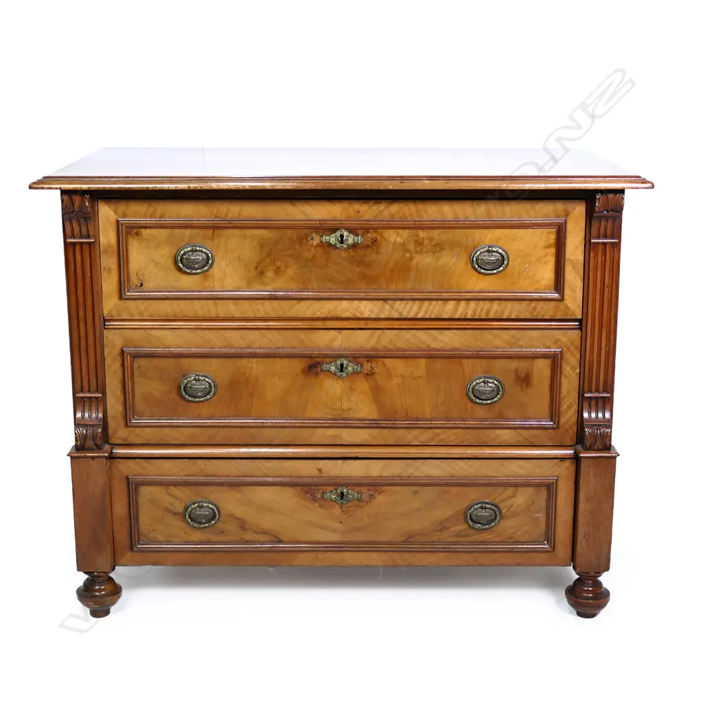 A Biedermeier style continental walnut chest of drawers, three full width drawers with carved sides, raised on turned feet.  990 x 530 x 770mm. Image 1++
