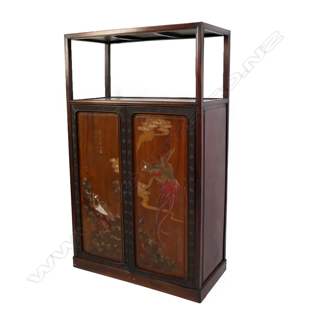 A vintage Chinese rosewood display shelf cupboard, the plain raised top shelf above a pair of tall cupboard doors with carved and painted phoenix, clouds, florals and calligraphy, enclosing three shelves and two drawers. 910 x 440 x 1515mm. Image 1++