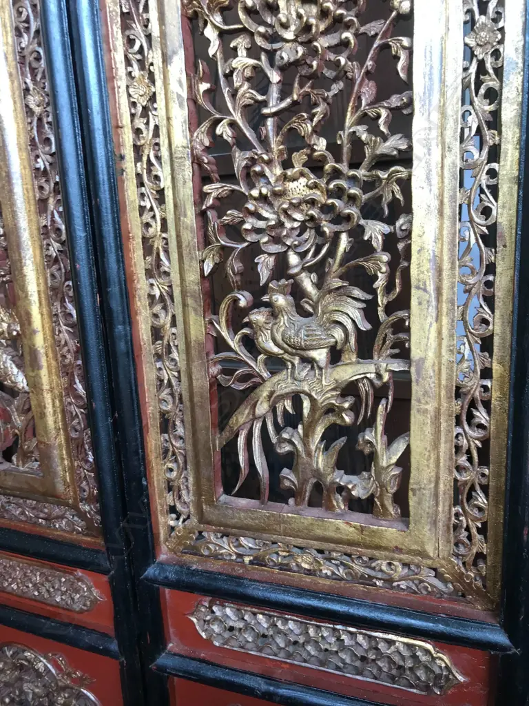 A 19thC six-fold Chinese screen, each panel with pierced decoration of calligraphy, birds and flowering branches, gilded with black and red paint finish, each panel measures 400 x 2050mm. Image 1++