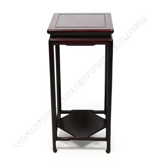A vintage Chinese rosewood vase stand, square form with plain round cylinder supports. 245 x 245 x 545mm.