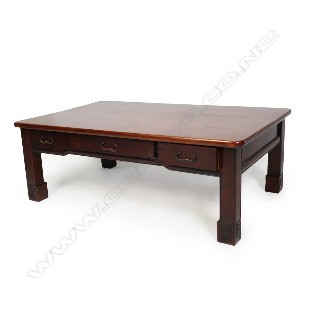 A vintage Oriental rosewood low table, plain rectangular form with three frieze drawers, raised on short square section legs with scroll feet. 880 x 540 x 310mm. Image 1++