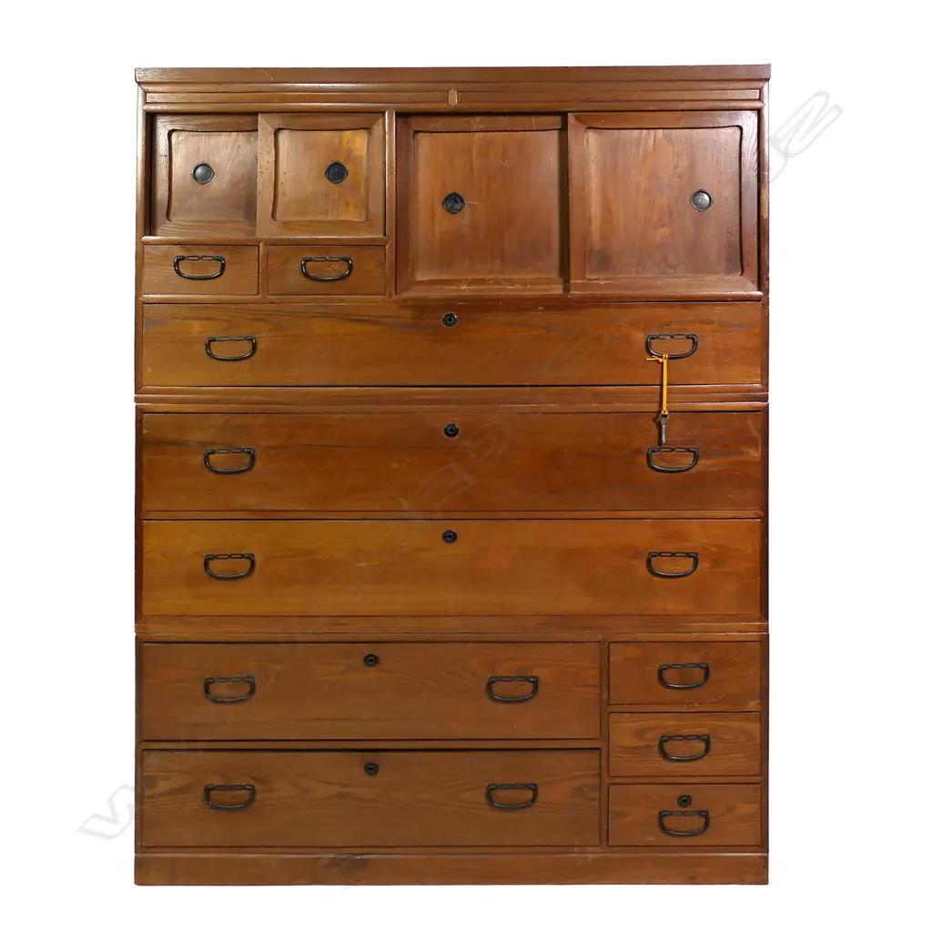 A Taisho period oak and cedar three section Japanese clothing chest, 10 assorted sized drawers and three cupboards. 1110 X 380 X 1510mm Image 1++