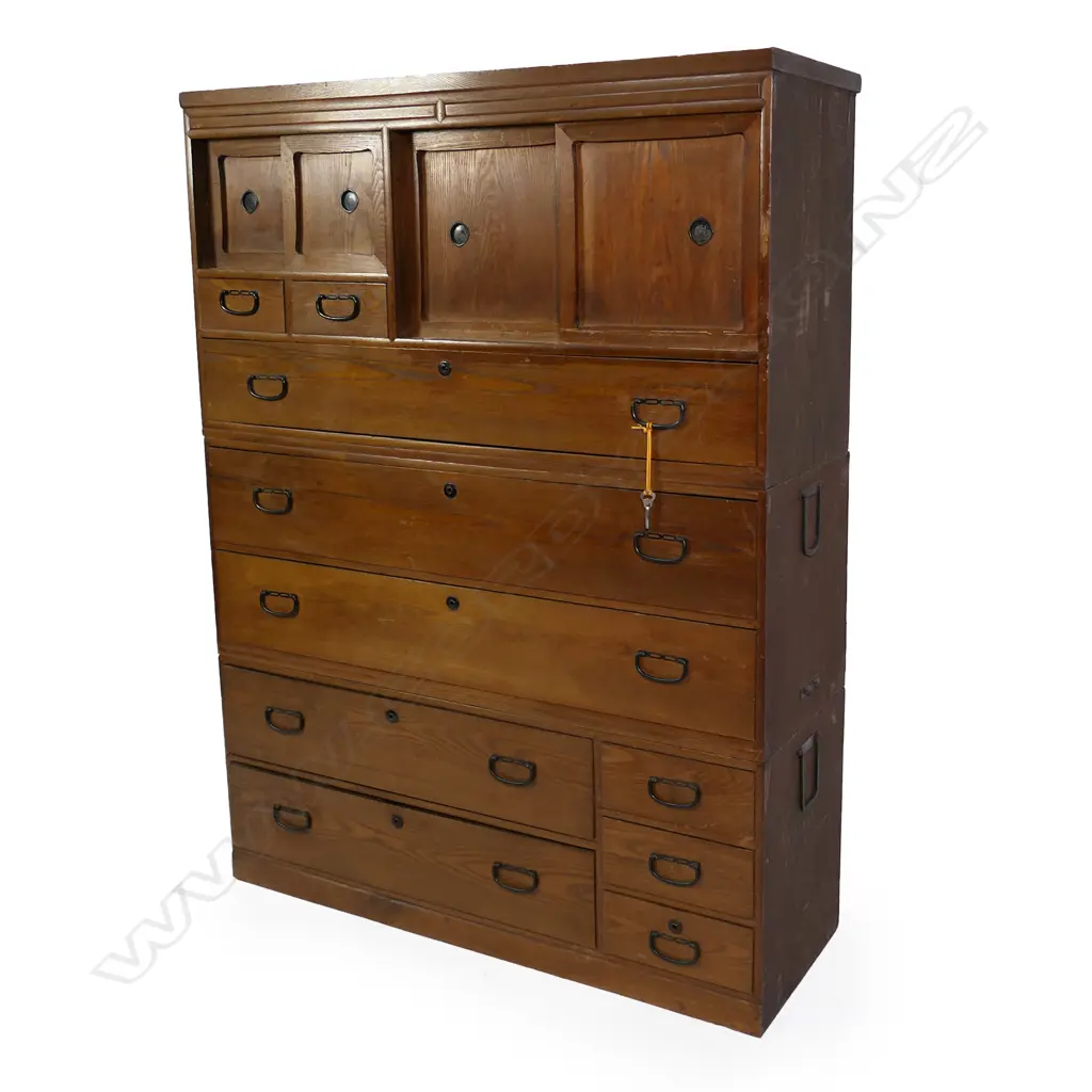 A Taisho period oak and cedar three section Japanese clothing chest, 10 assorted sized drawers and three cupboards. 1110 X 380 X 1510mm Image 1++