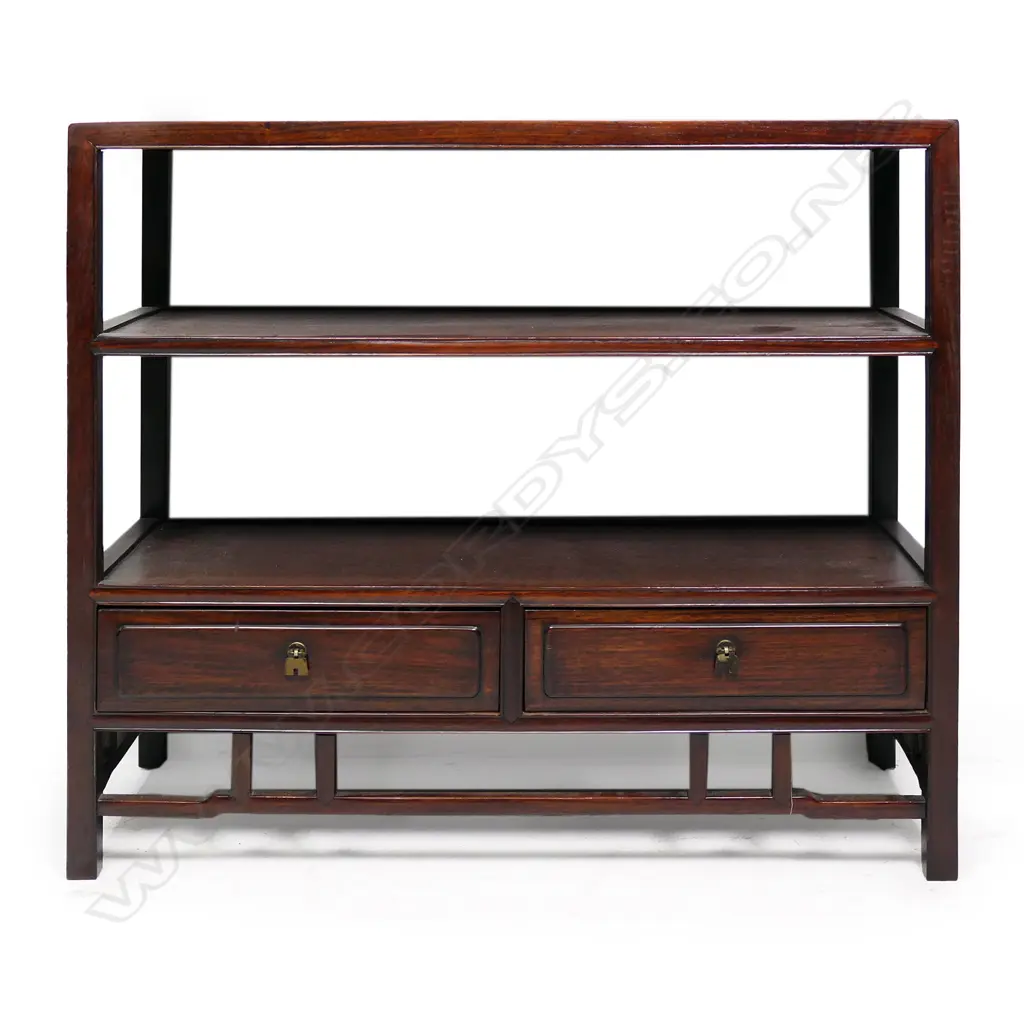 A vintage oriental display shelf unit, the three panelled shelves above two drawers and open frieze. Good dark patina. 765 x 300 x 690mm. Image 1++