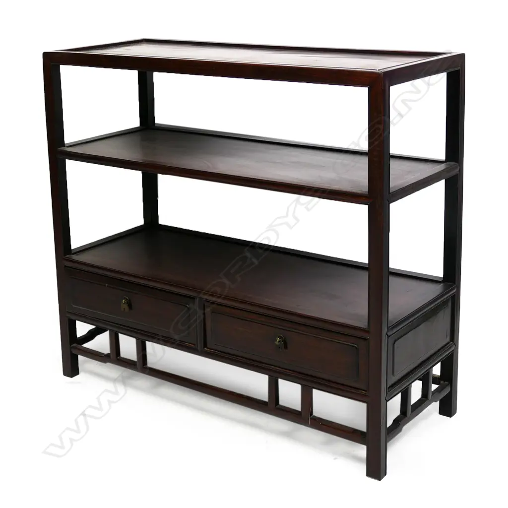 A vintage oriental display shelf unit, the three panelled shelves above two drawers and open frieze. Good dark patina. 765 x 300 x 690mm. Image 1++