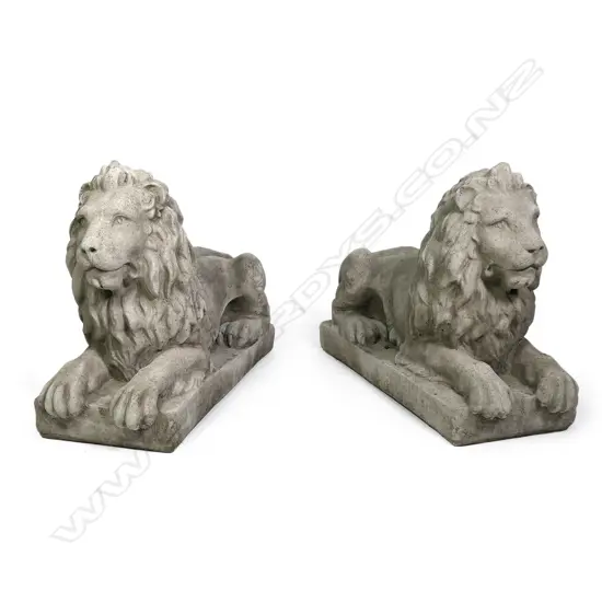A pair of large classical recumbent concrete lions, each on rectangular plinth base. 800 x 290 x 530mm. After Sir Edwin Landseer famous sculptures of the four lions at the base of Nelson's Column in Trafalgar Square, London.