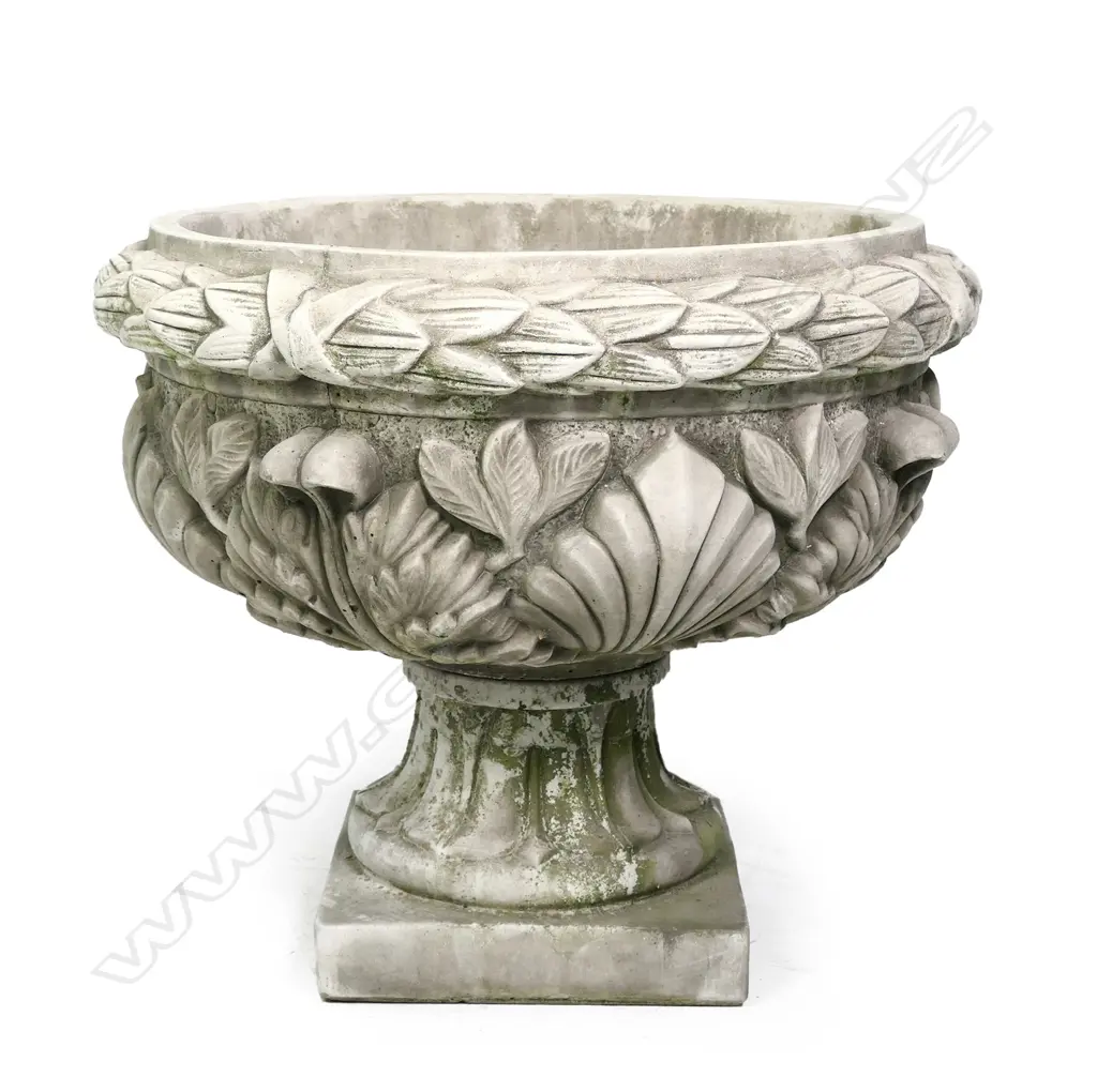 A quality English made cast concrete classical garden urn, wide form, decoratively cast in high relief with wreath boarder and leafy forms, the pedestal base with square foot. Dia.630mm. H.540mm. Image 1++