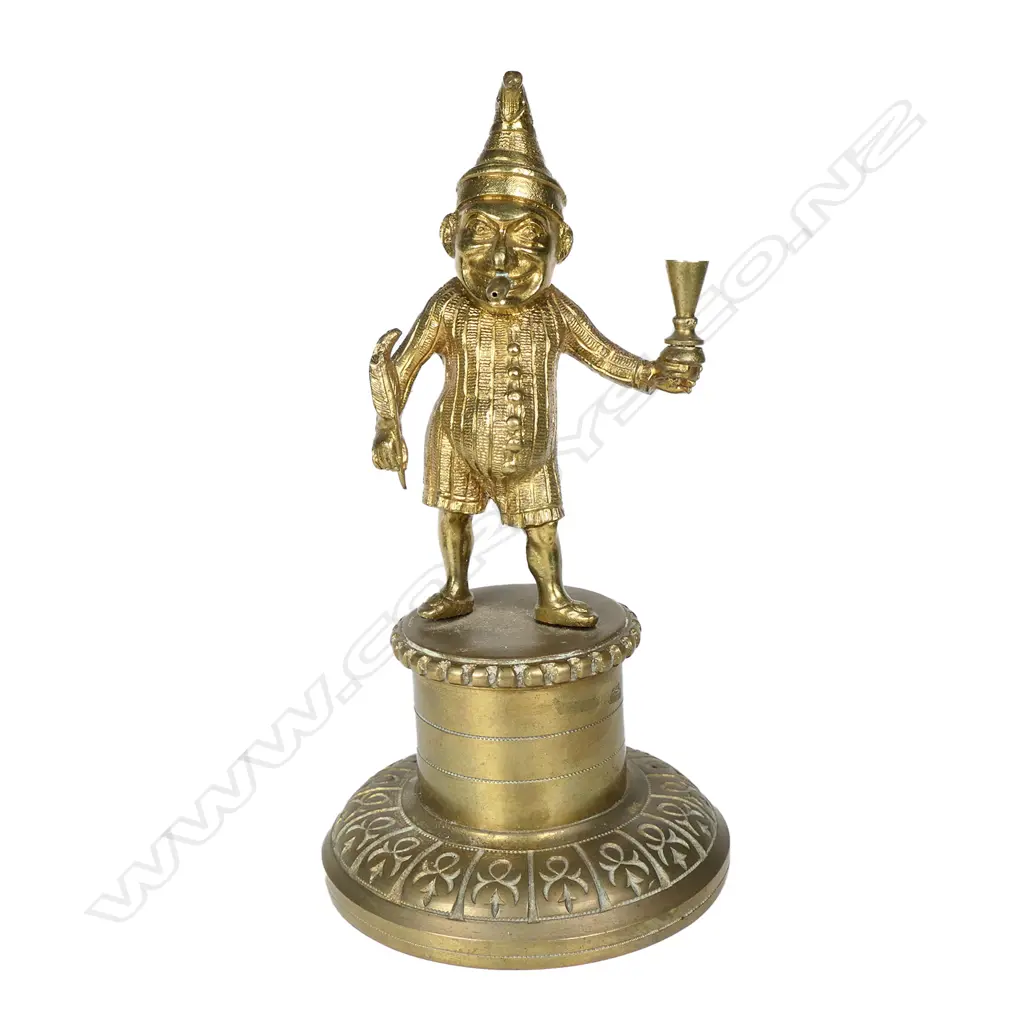 A vintage brass Mr. Punch cigar lighter Image 1++