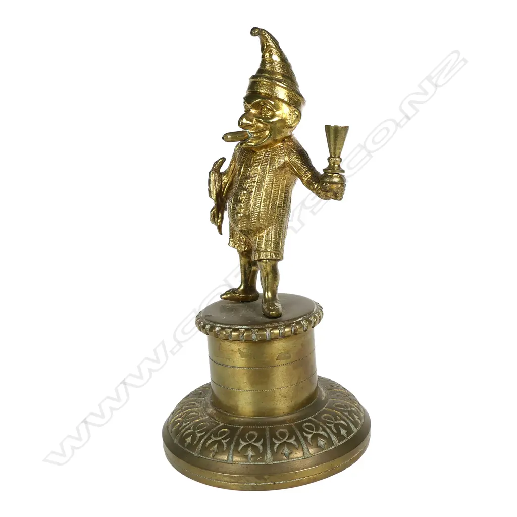 A vintage brass Mr. Punch cigar lighter Image 1++