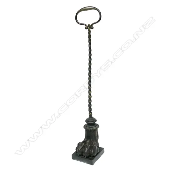 A Victorian bronze doorstop,
