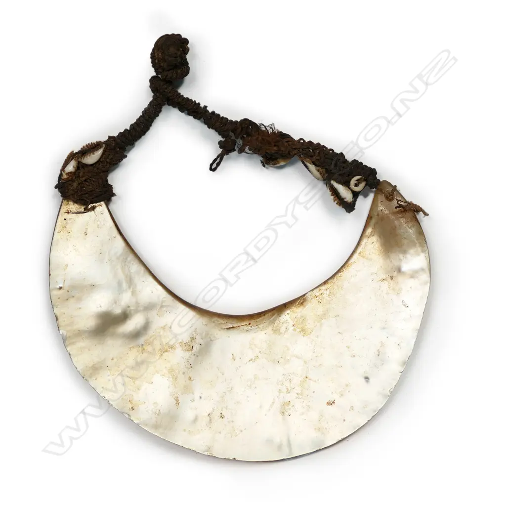 A breast ornament of mother of pearl shell (kina), Papua New Guinea, Image 1++