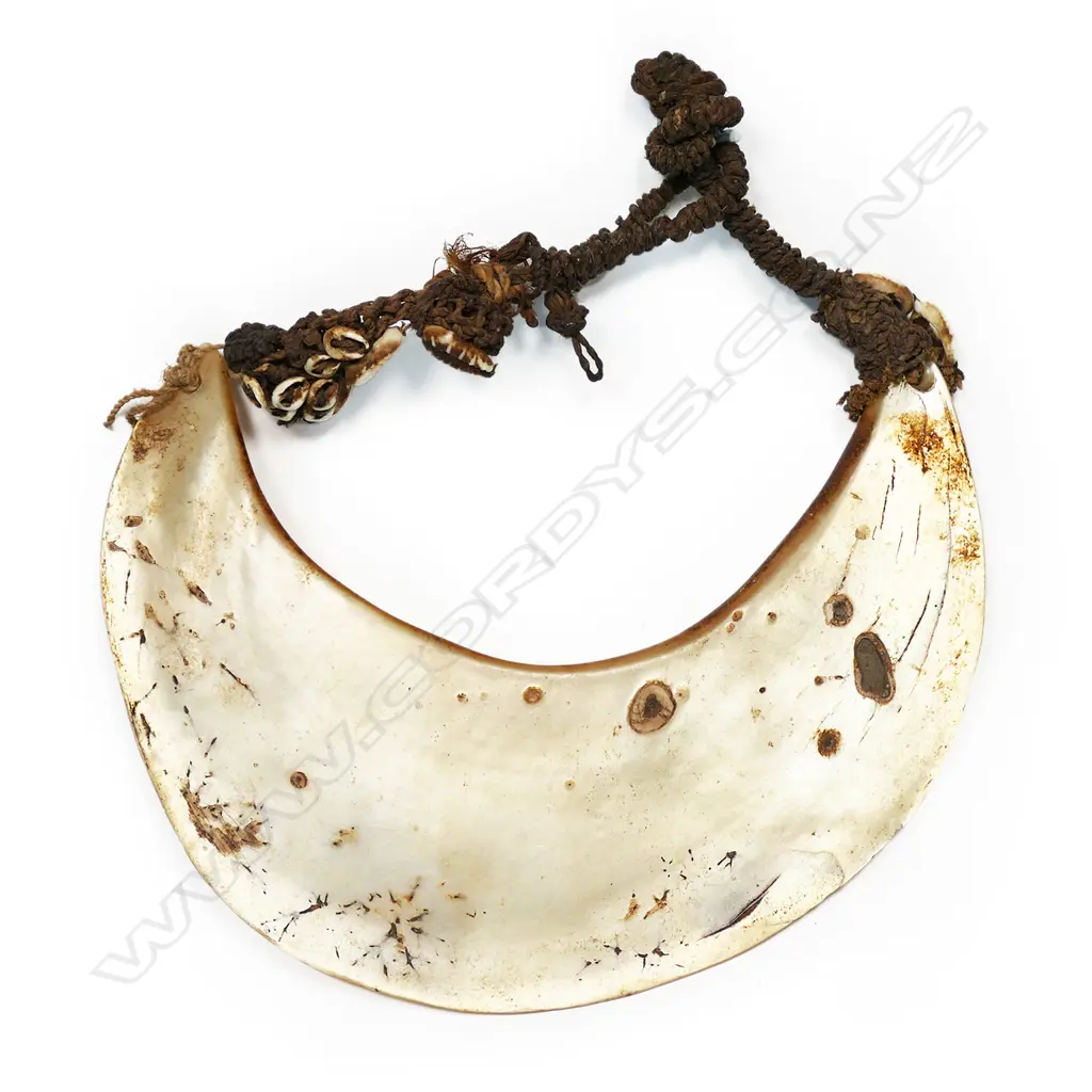 A breast ornament of mother of pearl shell (kina), Papua New Guinea, Image 1++