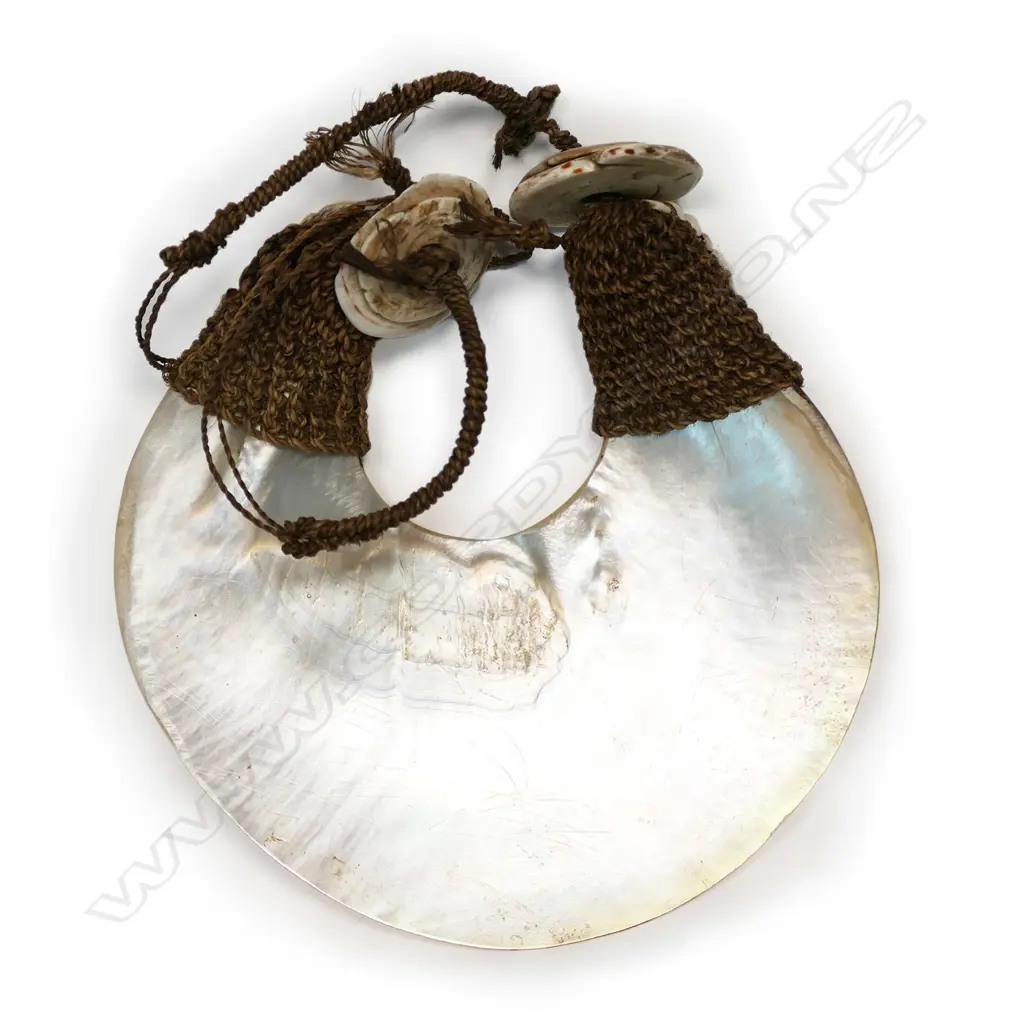 A breast ornament of pearl shell (kina), PNG, Image 1++