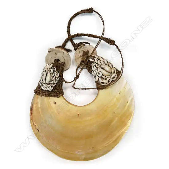A breast ornament of pearl shell (kina), PNG,