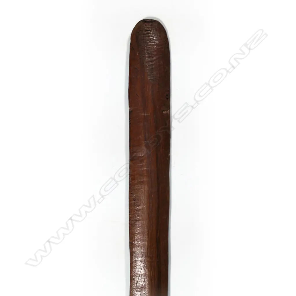 A 20thC Māori hardwood carved taiaha, of plain restrained short form. L.1090mm. Image 1++