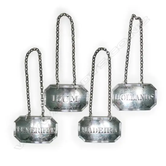 A set of four George III silver decanter labels,