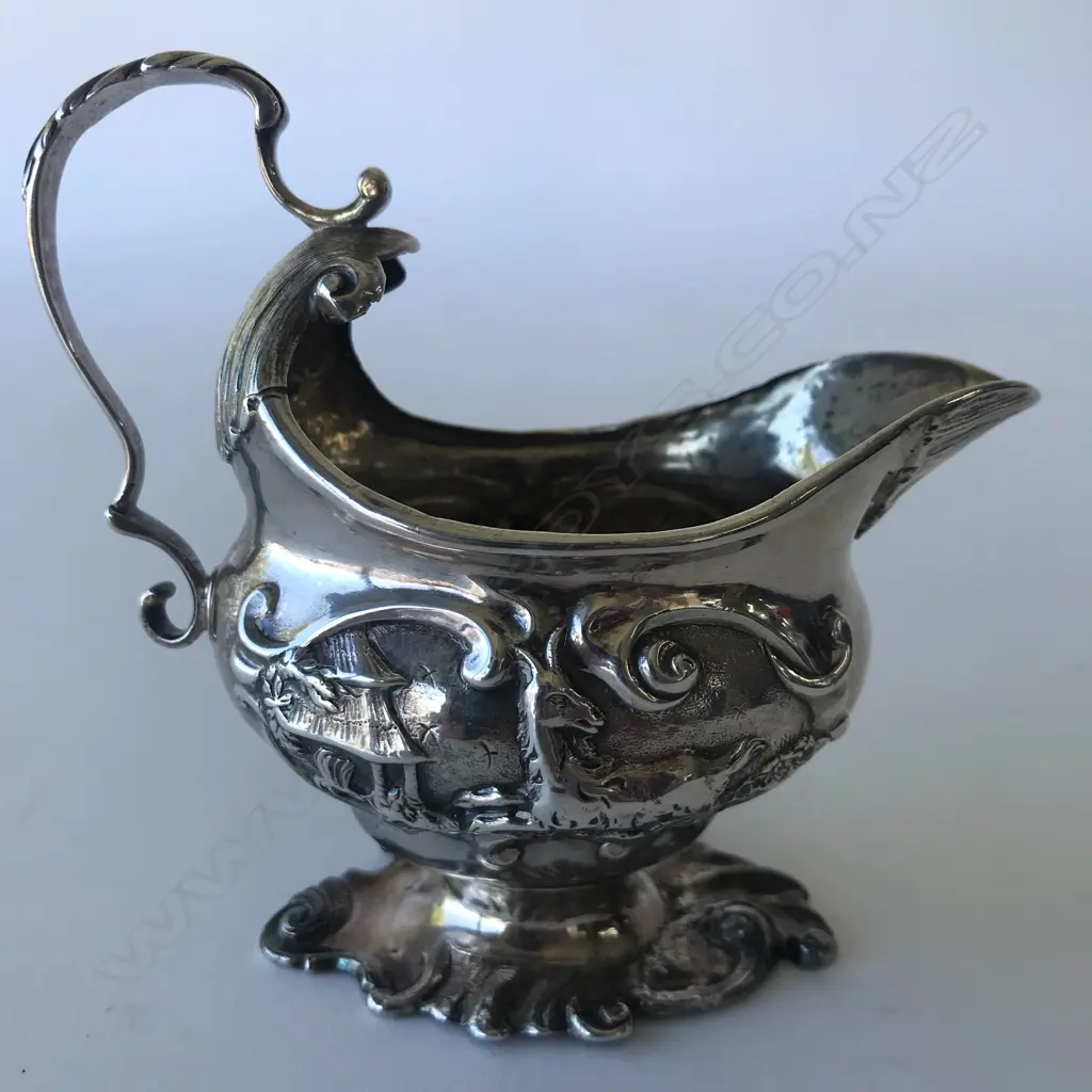 A rare George II silver creamer Image 1++