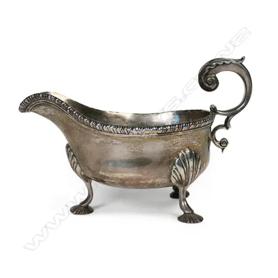 A weighty, Georgian style silver gravy boat,