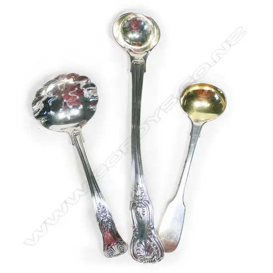 A George IV Queen's pattern silver cream ladle, along with a sifter spoon and mustard spoon,