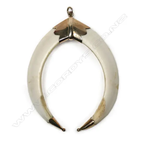 A c.1900 9ct rose gold and double boar tusk large pendant