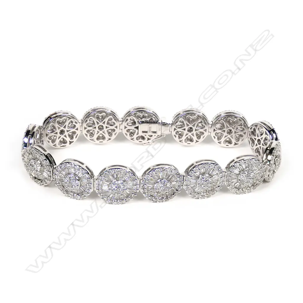 An 18ct white gold and diamond cluster bracelet, Image 1++