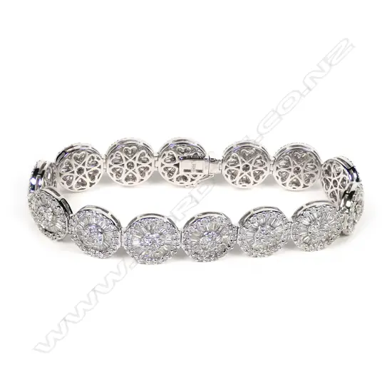 An 18ct white gold and diamond cluster bracelet,
