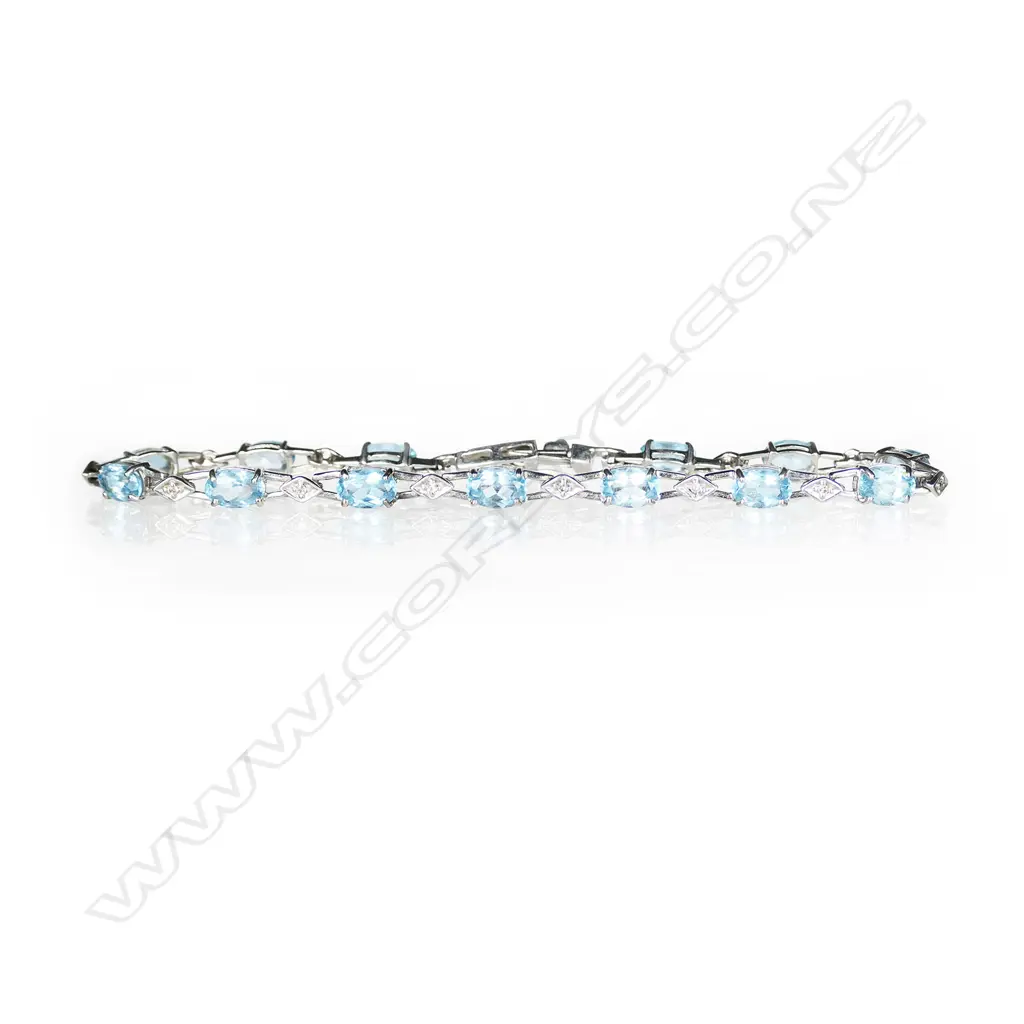A 9ct white gold blue topaz and diamond bracelet Image 1++