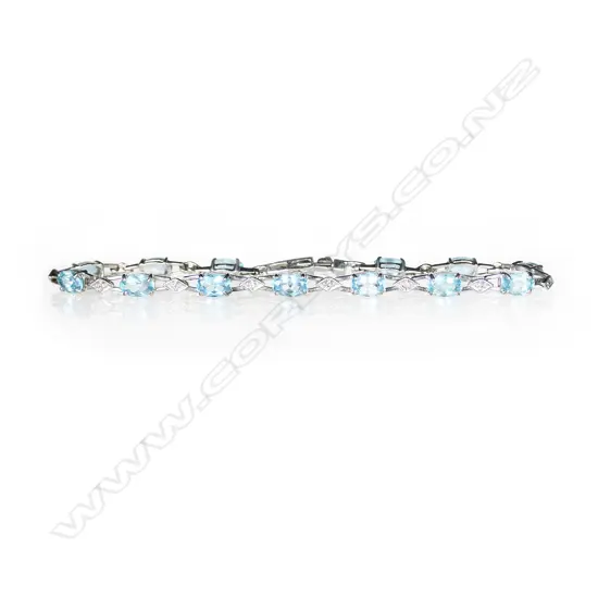 A 9ct white gold blue topaz and diamond bracelet