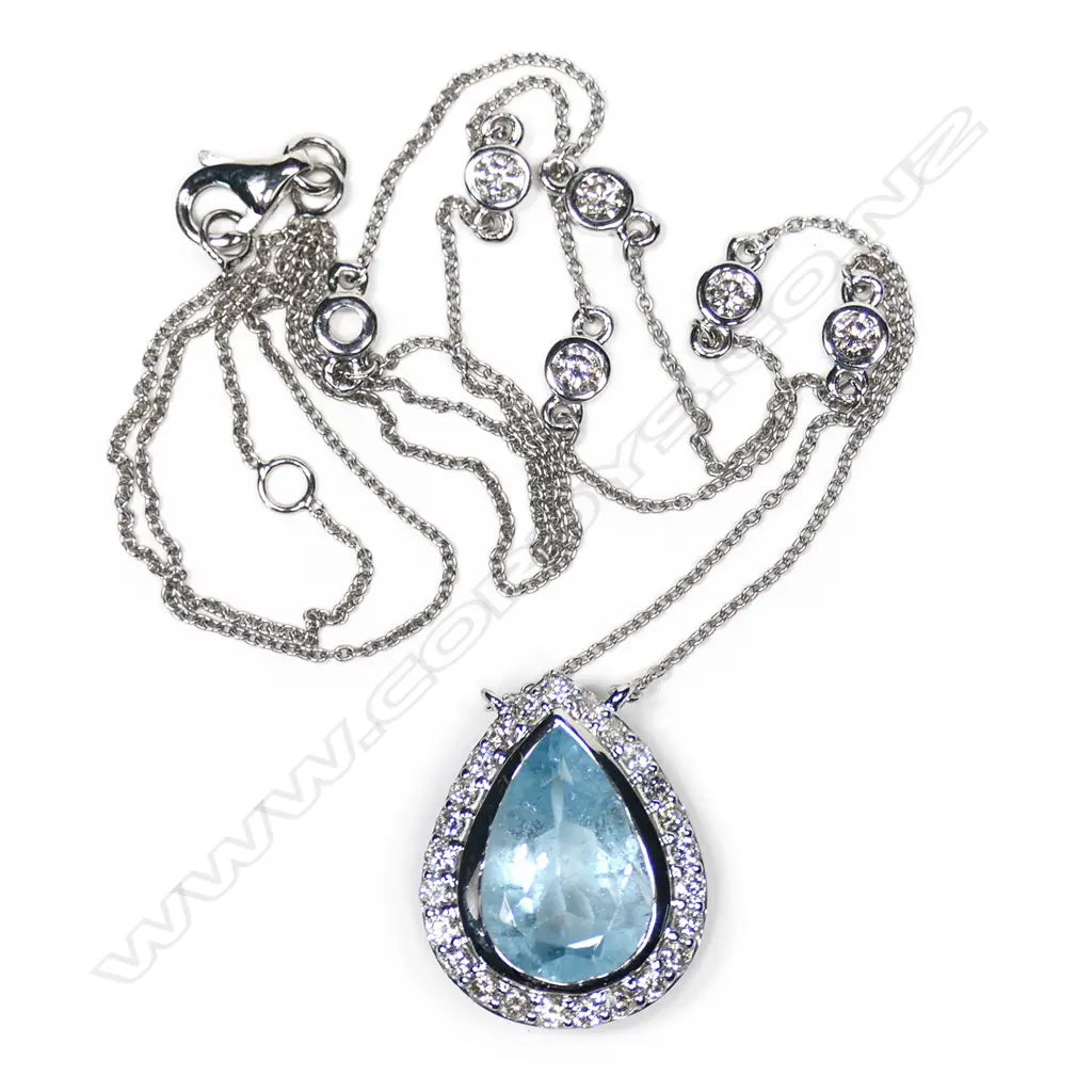 A 14ct white gold, aquamarine and diamond halo necklace, Image 1++