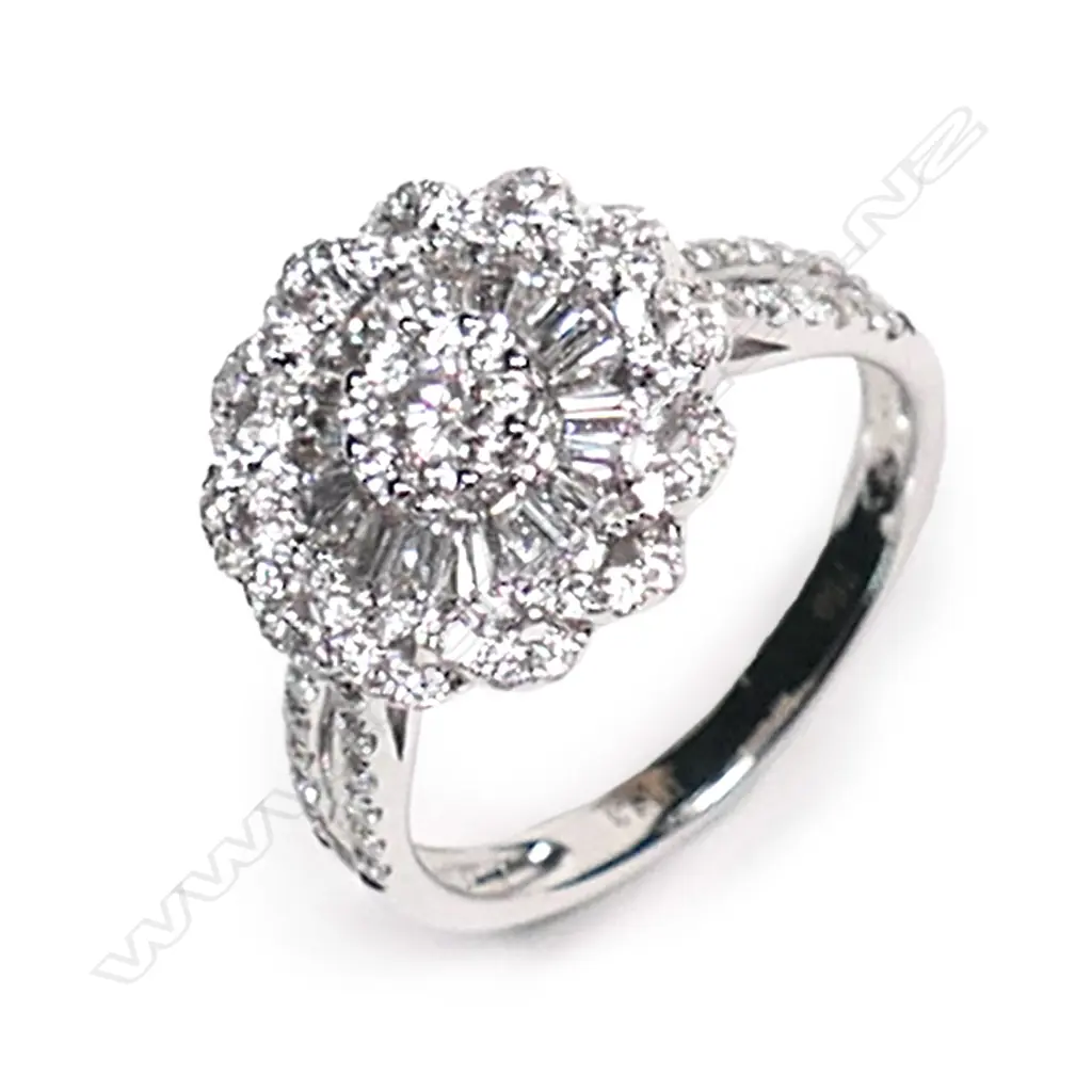An 18ct white gold and diamond cluster ring, Image 1++